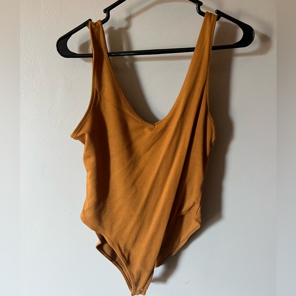 Large buttoned body suit